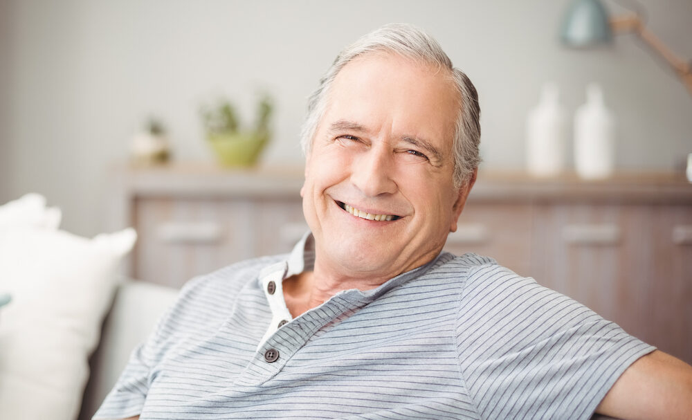 Happy smiling senior man with healthy eyes