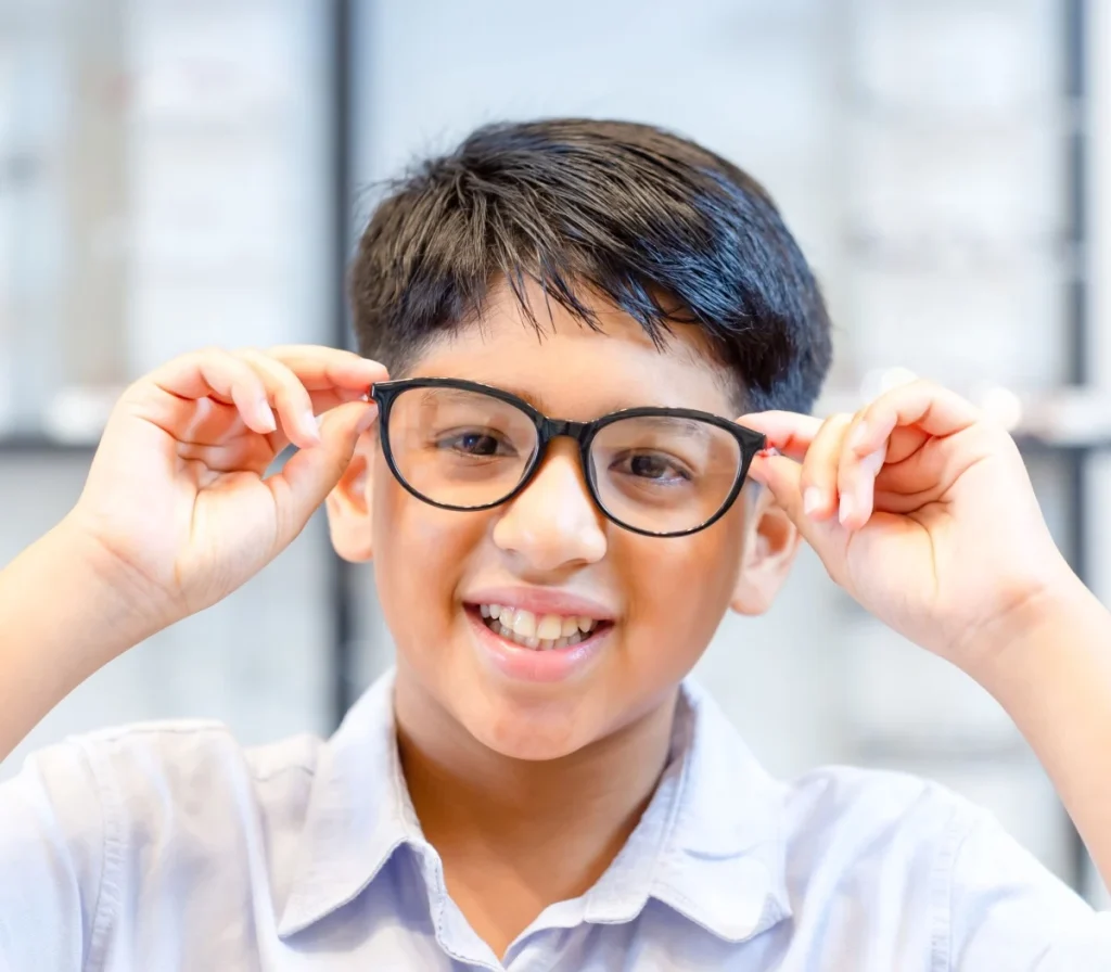 young boy wearing glasses for vision correction